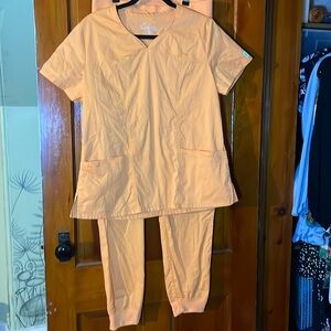 orange butter-soft medium scrub set, pants are medium-tall with elastic ankles